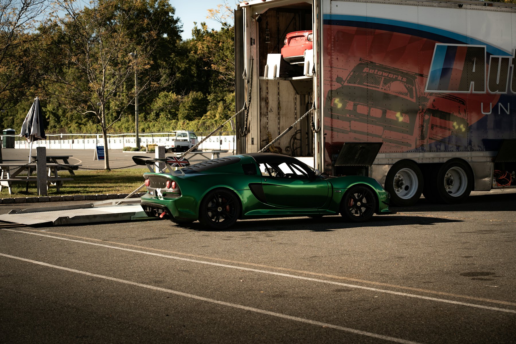 Sports car being loaded into an enclosed car trailer